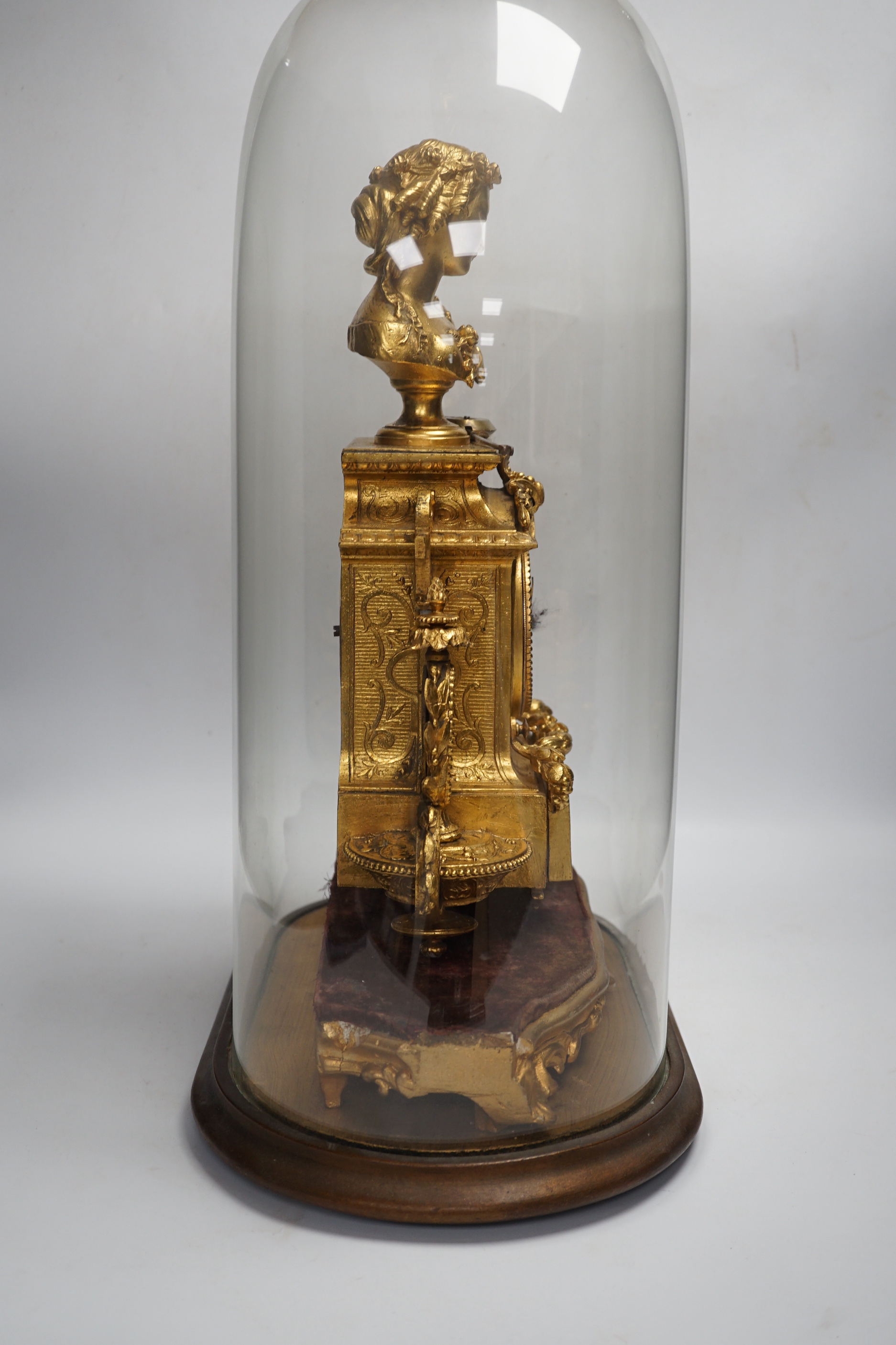 A late 19th century French gilt-spelter mantel clock with enamel panels, under glass dome, 54cm